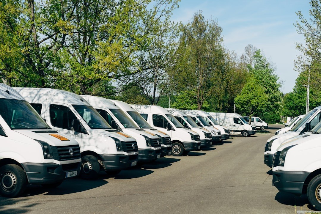 A fleet of white vans lined up